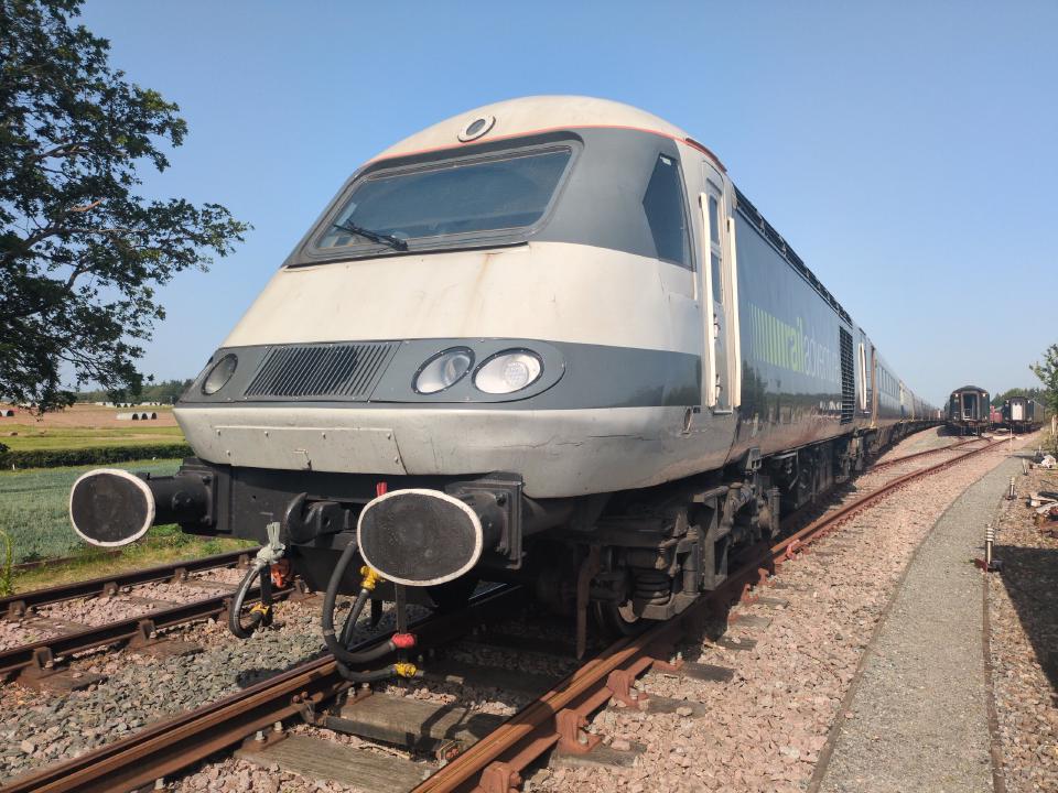A Class 43 locomotive (the HST kind), a sleek 70s locomotive, painted in grey.