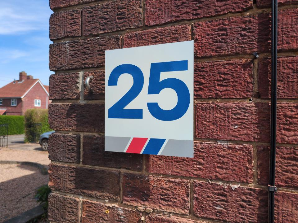A house number sign for the number 25, in the style of Network SouthEast's platform number signs.