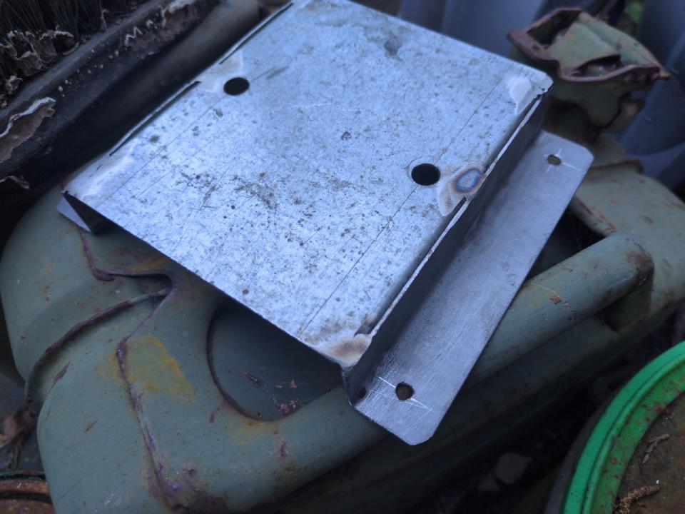 A stand-off bracket made of some bits of galvanised steel welded together.