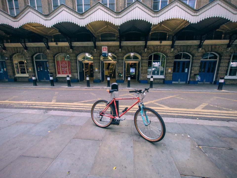 My red (faded to orange) Ridgeback 601GS. It has custom teal-painted forks and shiny mid-90s parts.