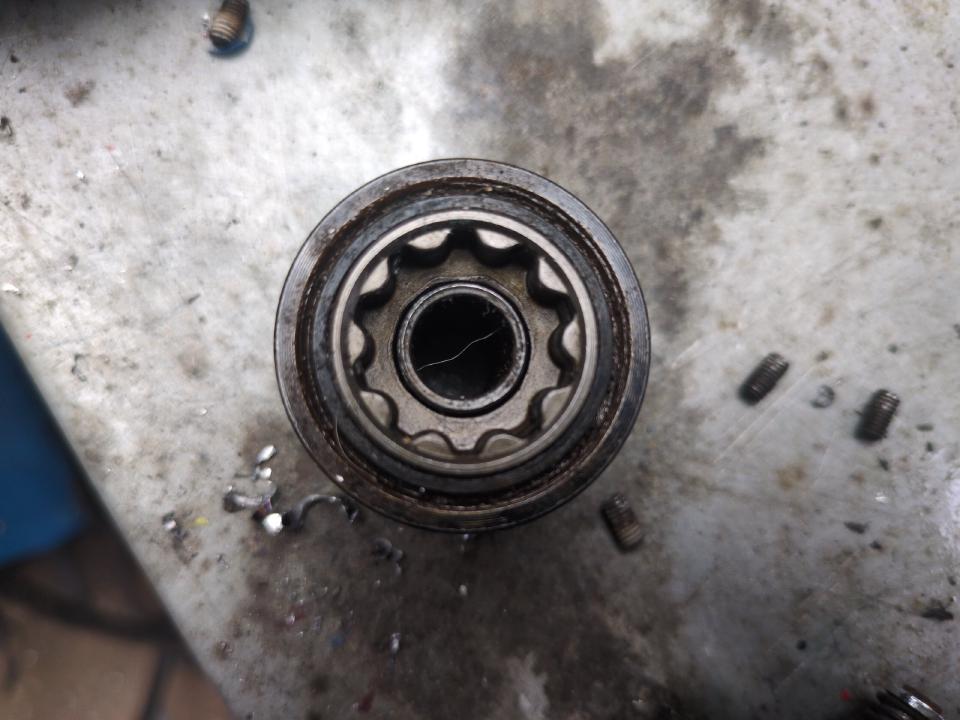 A photo of the rear of a Shimano STX-RC freehub body; instead of teeth sticking out, it has "female" teeth designed to engage with teeth on the hub.